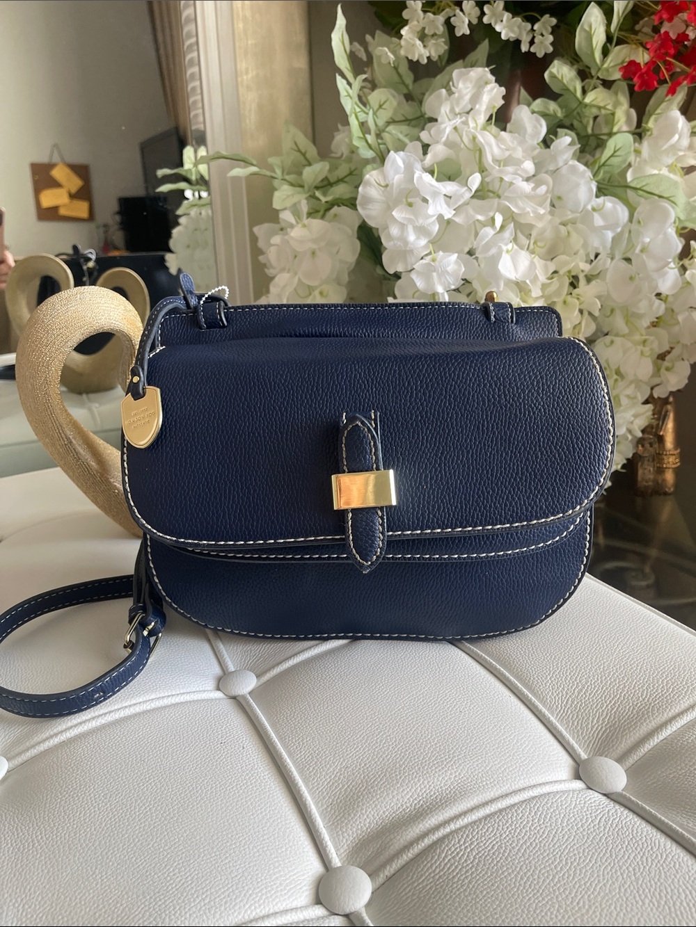 London Fog Lorraine crossbody bag in navy blue with a pebbled leather